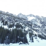 Standing in the middle of frozen over Colchuck lake looking SE