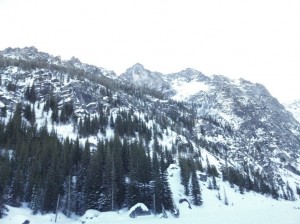 Standing in the middle of frozen over Colchuck lake looking SE