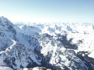 From the summit: more washed out mountains and the tip of Stuart - king of the range - just in view on the left.